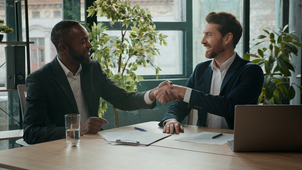 property management professionals discussing documents at a table